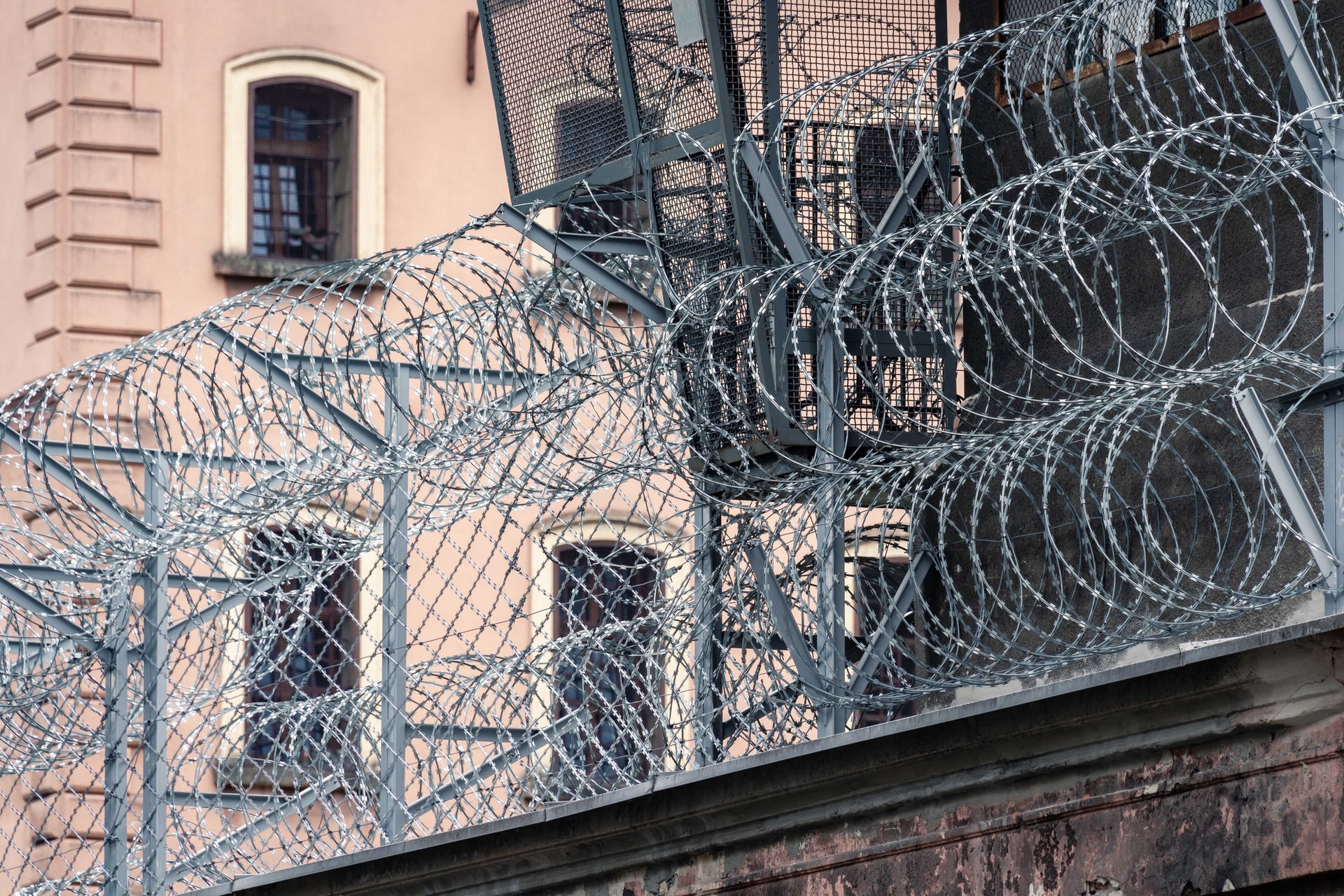 Barbed wire atop prison wall