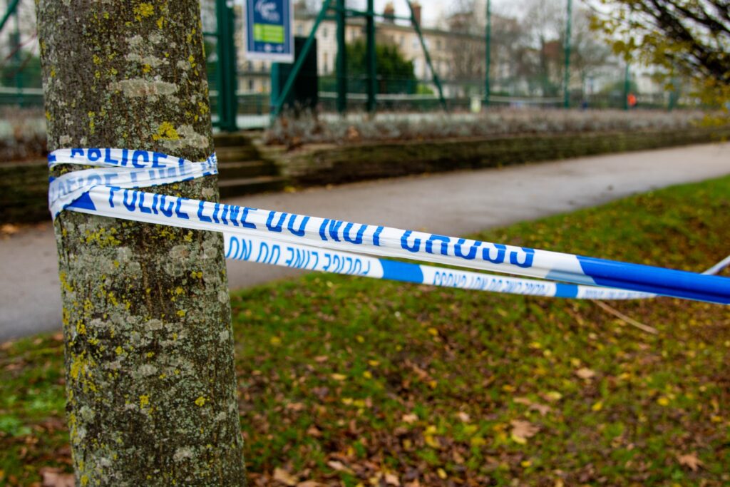 outdoor crime scene tape representing gang related murder