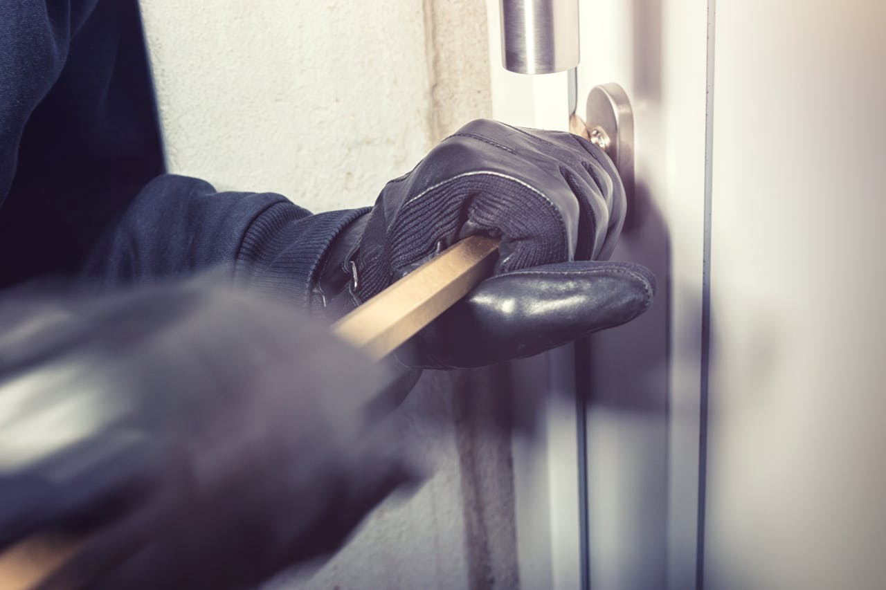 Person using forced entry representing break and enter charges in Ontario