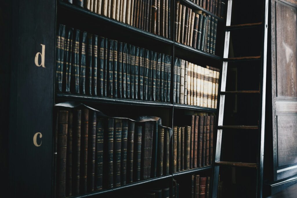 Old law books on a library shelf, representing Judicial Pre-Trials and Canadian criminal law. law